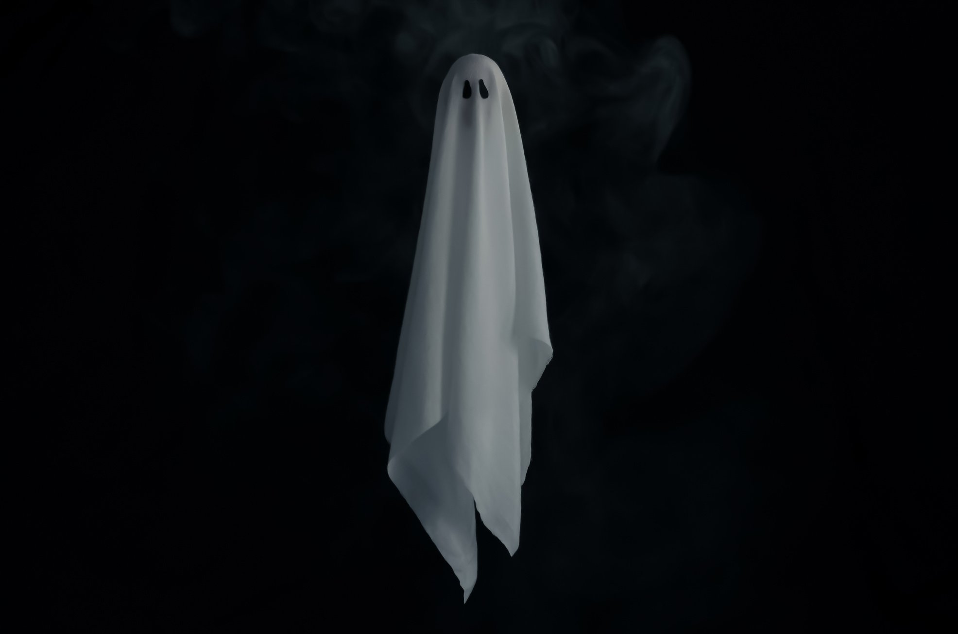 White Ghost Sheet in Black Background